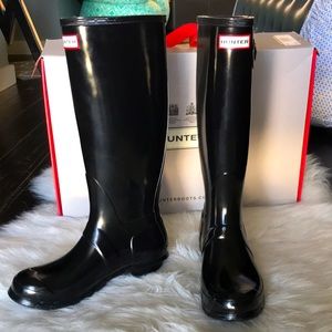 Hunter tall rain boots.